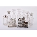 A collection of silver mounted cruet items