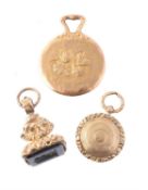 Three small gold or gold cased items