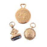 Three small gold or gold cased items