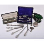 A cased Edwardian silver mounted seven piece manicure set by Robert Pringle & Sons