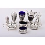 An Edwardian silver three piece cruet set by Haseler Brothers