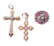 An early 20th century ruby and half pearl cross pendant