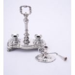 A Victorian silver shaped oval chamberstick and snuffer by Henry Wilkinson & Co.