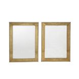 A pair of brass framed wall mirrors