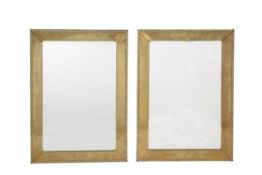 A pair of brass framed wall mirrors