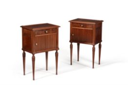 A pair of 'plum pudding' mahogany bedside cabinets