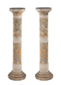A pair of sectional veined alabaster columnar pedestals