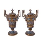 A pair of French gilt metal and champlevé enamel twin handled side or garniture urns and covers