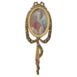 A carved giltwood picture frame in Louis XVI style