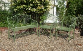 A green painted metal garden suite