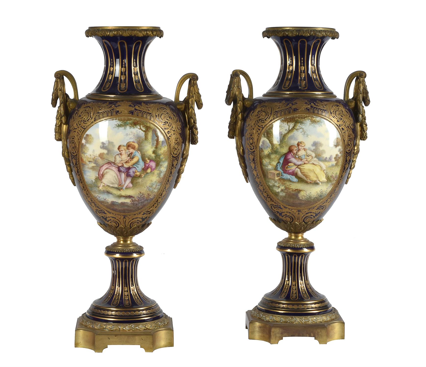 A pair of Sevres-style gilt-metal mounted pottery vases