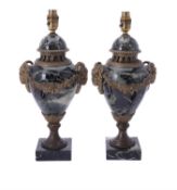 A pair of gilt metal mounted green Serpentine marble table lamps
