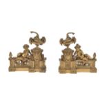 A pair of French gilt metal chenets in Louis XVI style