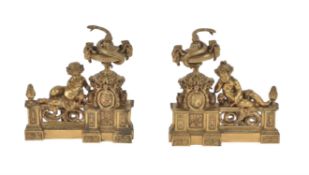 A pair of French gilt metal chenets in Louis XVI style