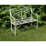 A Regency white painted wrought and cast iron garden seat