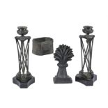 A pair of French patinated and lacquered metal candlesticks in Neoclassical style