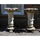 A pair of stone composition birdbaths