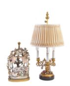 A German porcelain and gilt metal mounted twin light table lamp