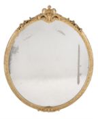 A Victorian giltwood and composition oval wall mirror