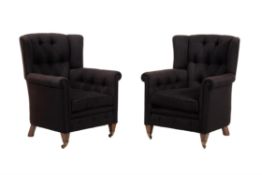 A pair of hardwood and upholstered armchairs