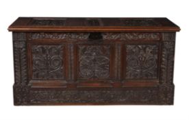 A carved oak plank coffer