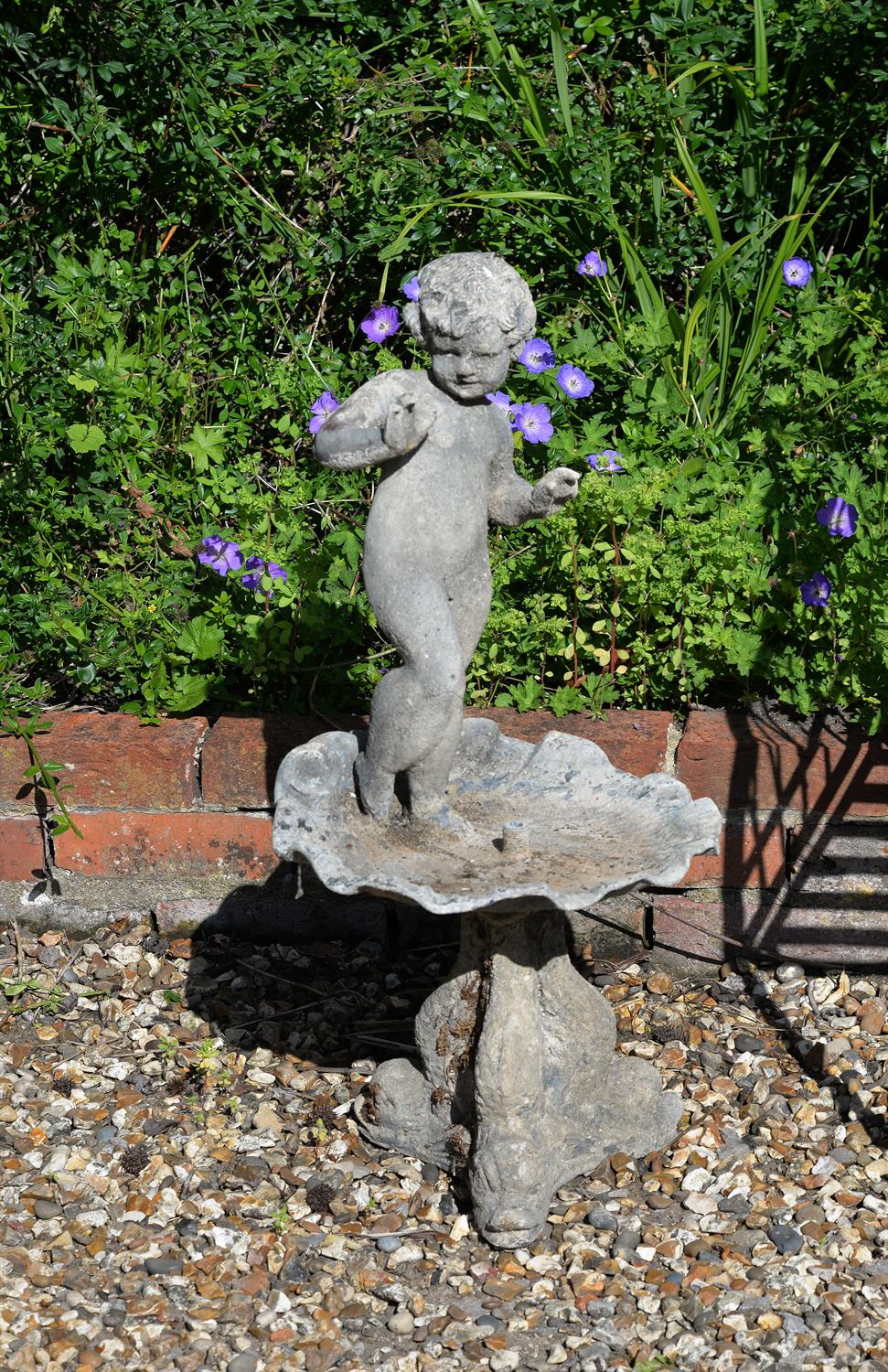 A cast lead figural bird bath or small fountain