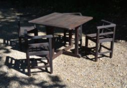 A stained wood garden furniture set in the style of designs by Heal's