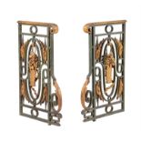 'A pair of Continental, probably French, green and gold painted cast and wrought iron railing ends