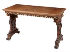 A Renaissance Revival walnut and parcel gilt library table