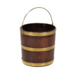 A George III circular mahogany and brass bound bucket