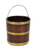 A George III circular mahogany and brass bound bucket