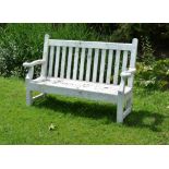 A white painted garden seat