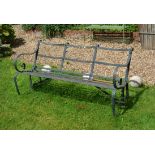 A black painted wrought iron garden bench
