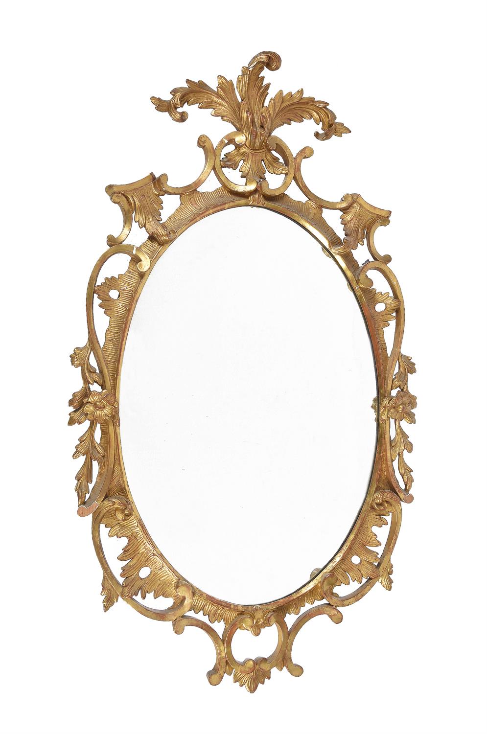 A George III giltwood oval mirror