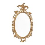 A George III giltwood oval mirror