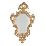 A pair of giltwood cartouche shaped mirrors