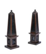 A pair of oak and ebonised obelisks