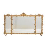 A Victorian giltwood and composition triptych wall mirror