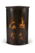 A George II green painted and parcel gilt chinoiserie decorated corner cupboard