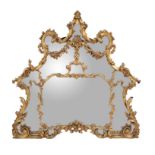 A carved giltwood overmantel mirror