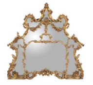 A carved giltwood overmantel mirror