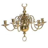 A matched pair of six light brass chandeliers