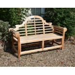 A pair of teak garden benches