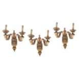 A set of three giltwood and gesso twin branch wall lights in Regence style