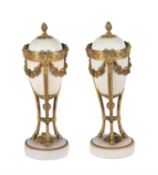 A pair of gilt-bronze and white marble mounted cassolettes in Louis XVI style