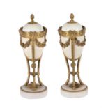 A pair of gilt-bronze and white marble mounted cassolettes in Louis XVI style