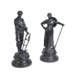 A pair of Continental lacquered spelter models of rustic folk
