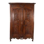A French carved walnut armoire