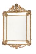 A giltwood and composition wall mirror in Regence style