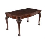 A carved mahogany centre table, in George II style